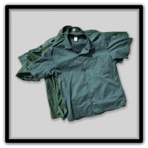 Layered group of dark green short-sleeve vintage workwear shirts.